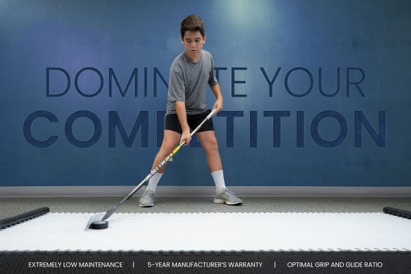 Hockey player refining skills on Skate Anytime Dryland Panels, mastering techniques off the ice.